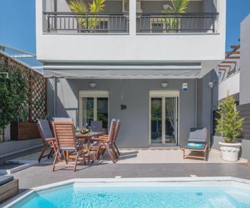 Grey House by Checkin