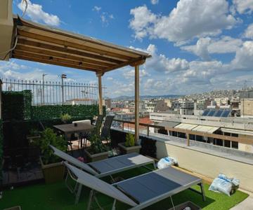 Rooftop Tiny Suite-roof Deck-sunbeds-city View
