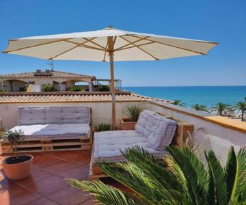 Cal SalMaré seafront apartment with rooftop terrace and pool