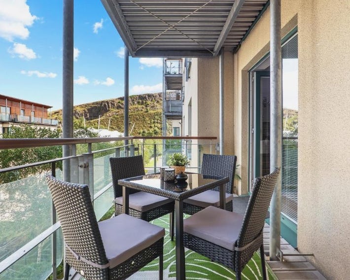 Central 2BR Park Royal Apartment with Balcony and Parking